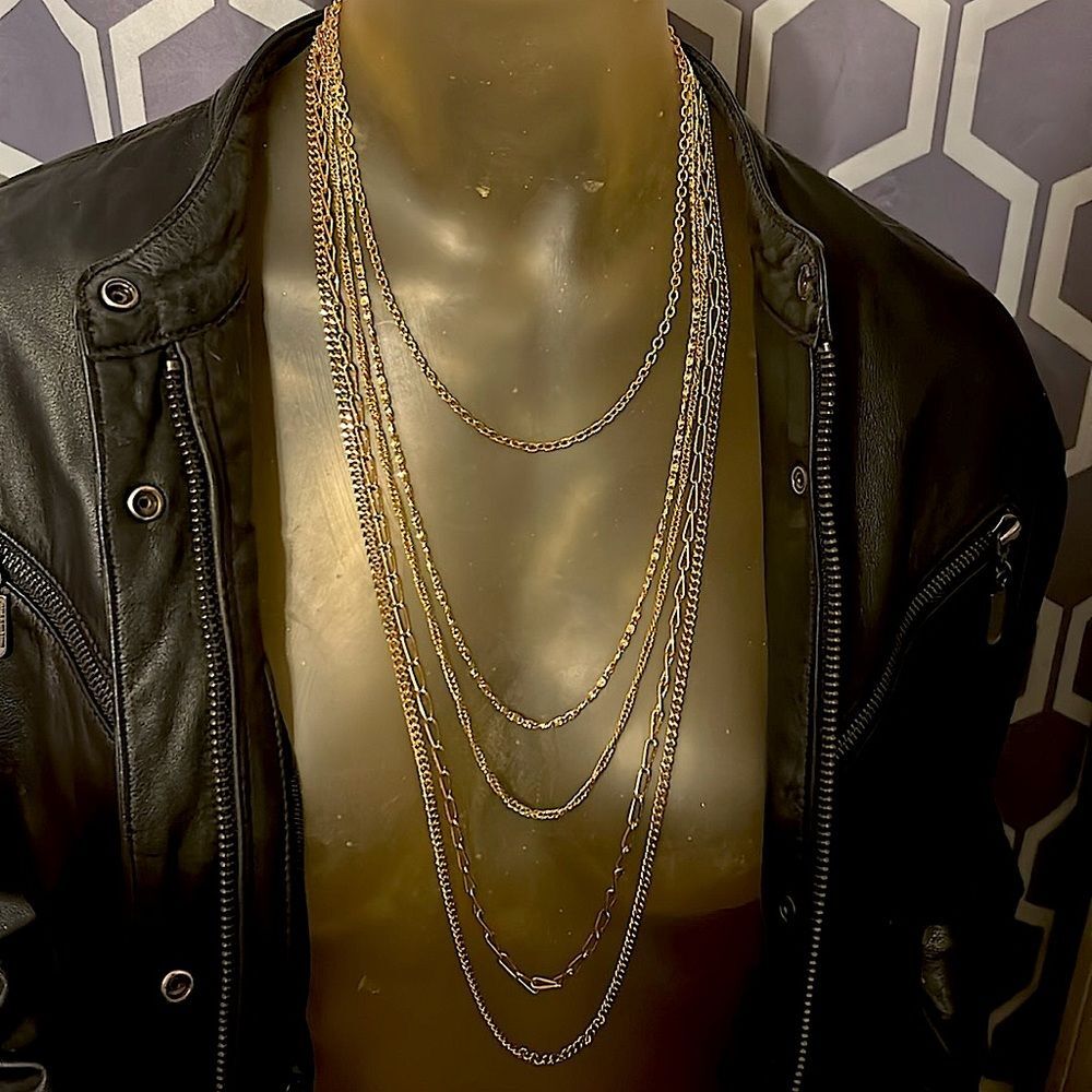 “5-in1” gold tone chain. All clasps locked together with the same clip clasp.